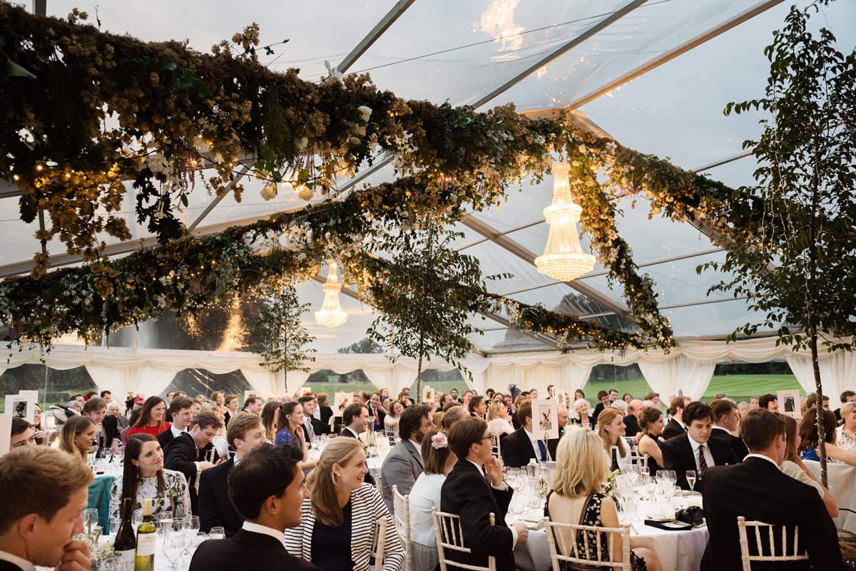 Speeches at dusk in a clear roof marquee