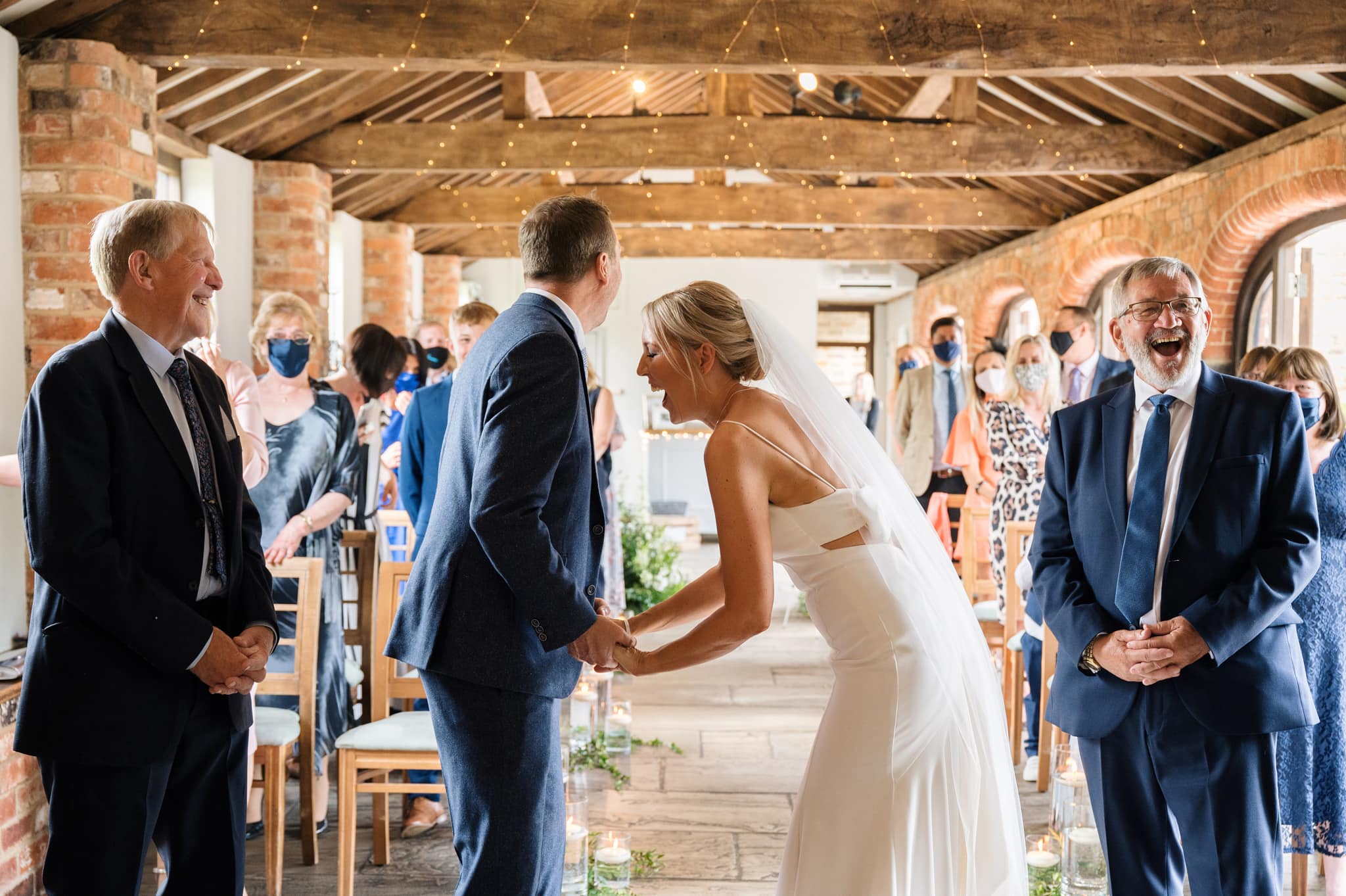 Bride doubled over laughing during ceremony at Dodmoor House