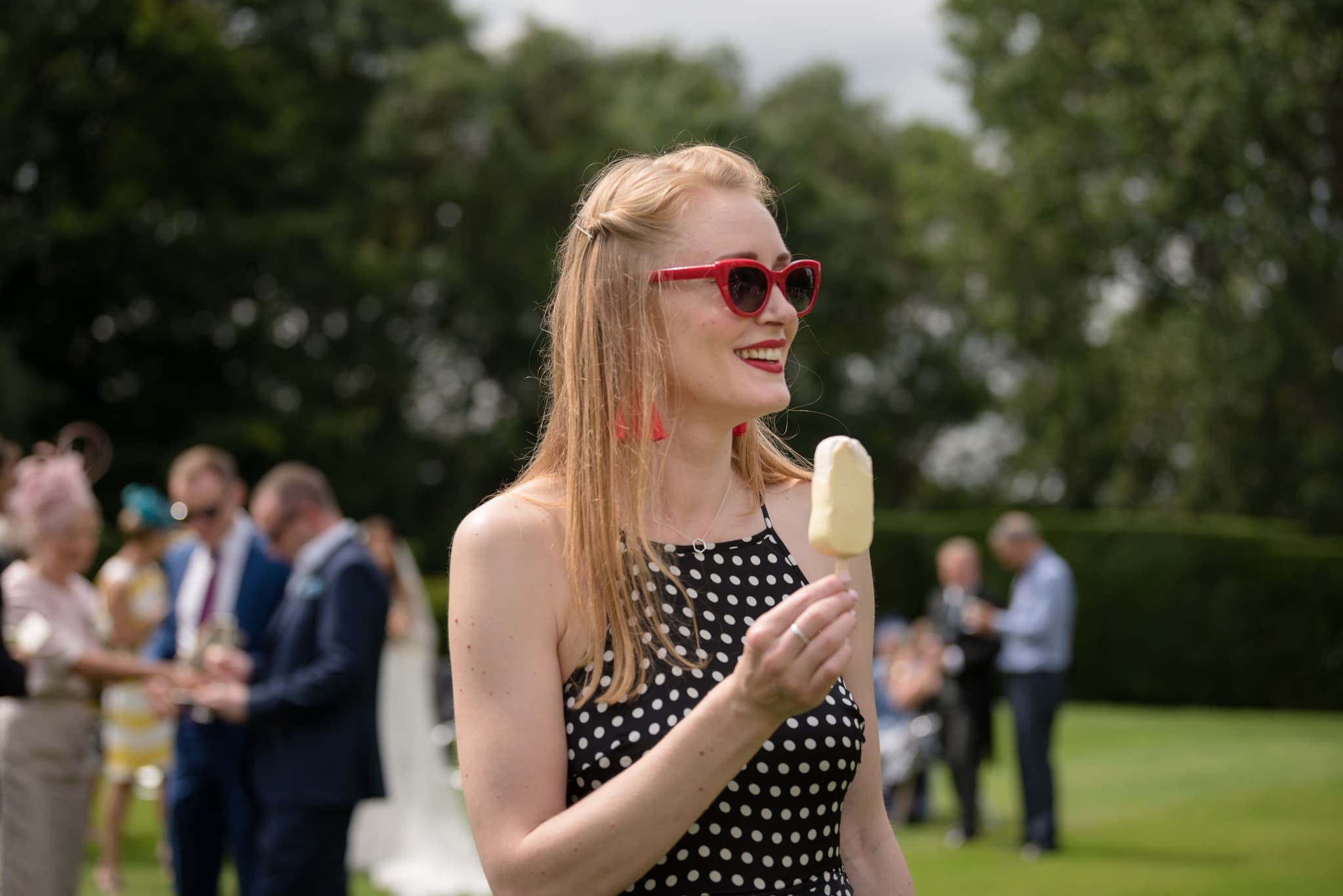 Wedding guest eating an ice-cream