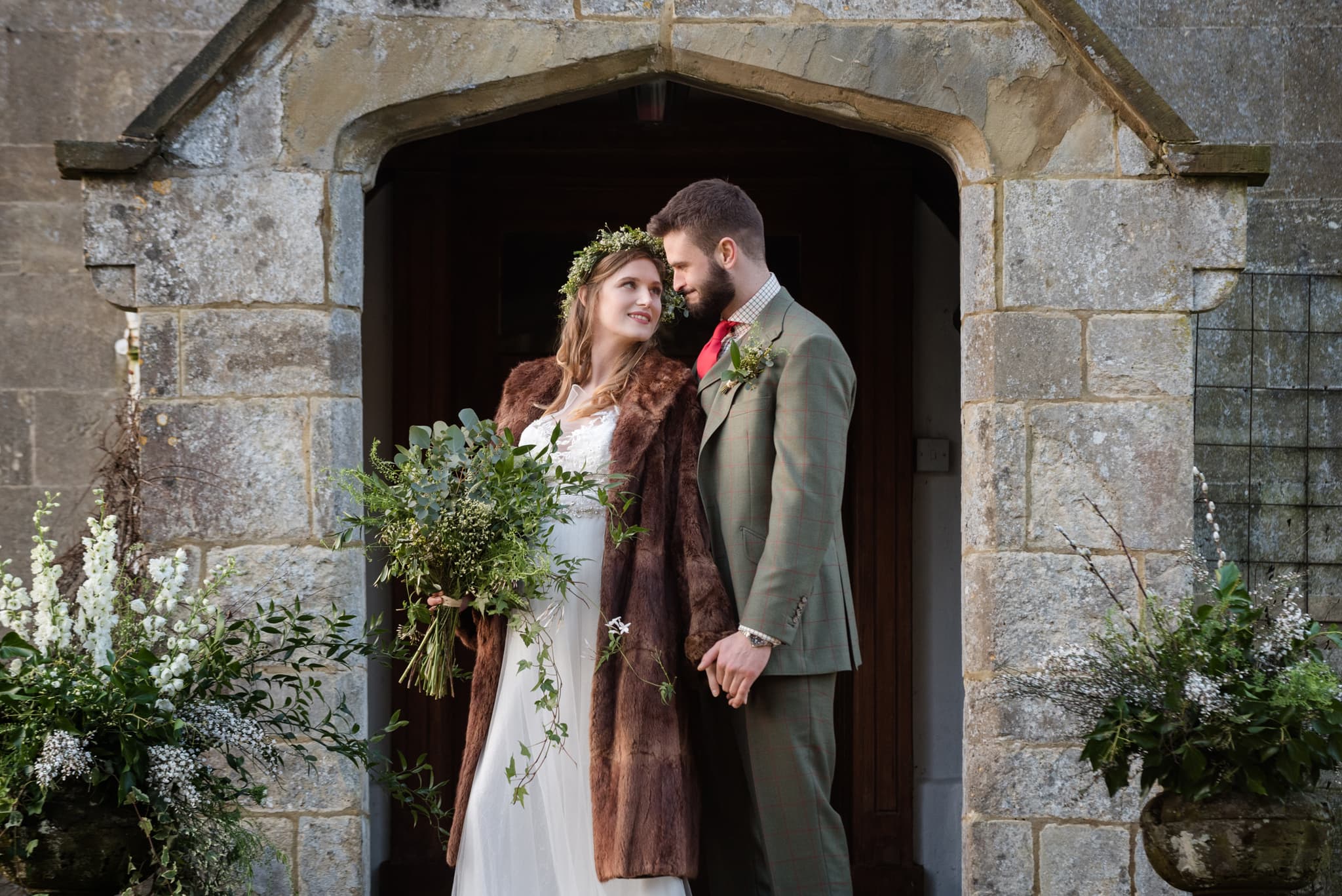 Bride wearing a vintage family fur coat