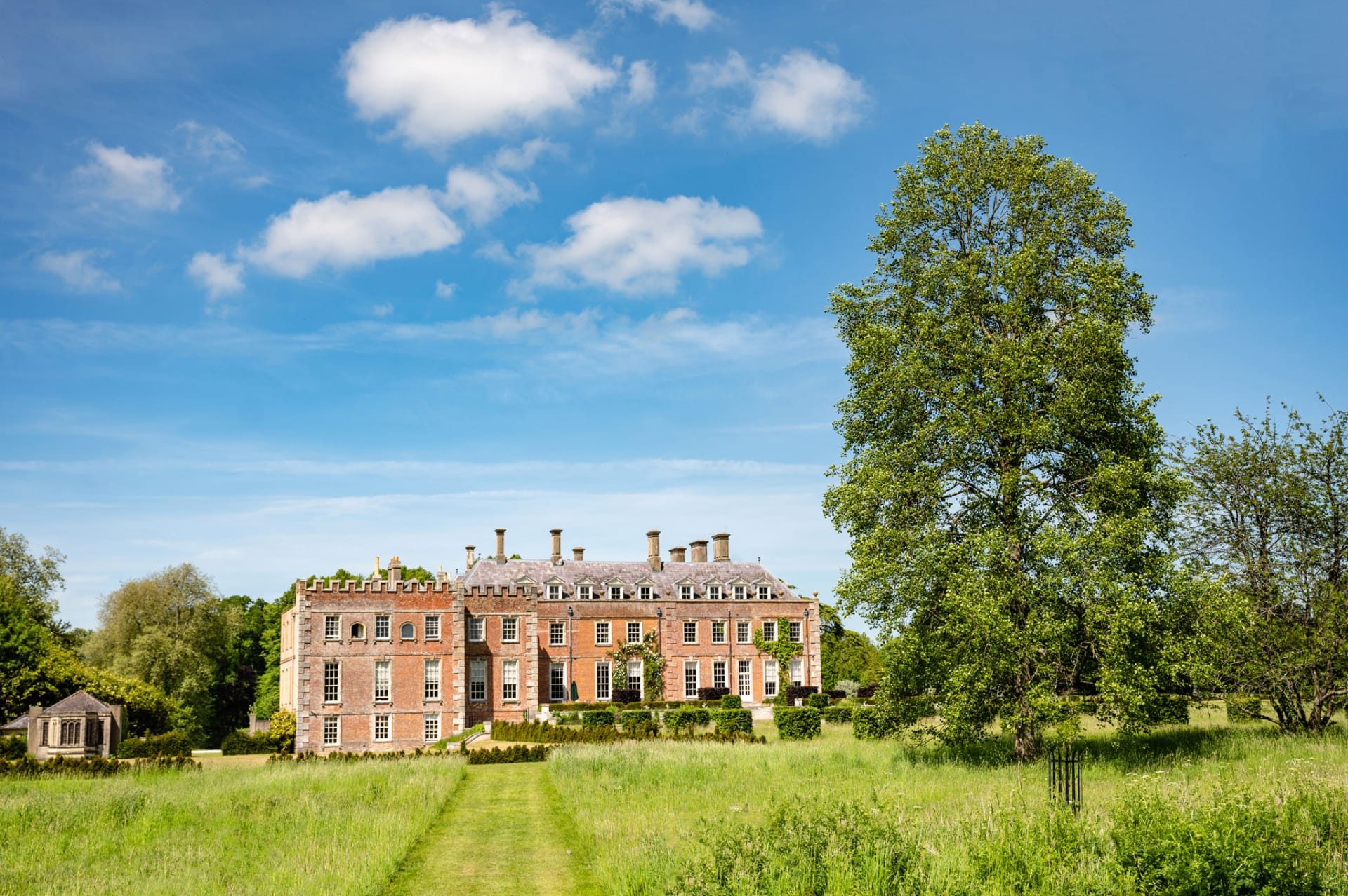 Bright blue sky behind St Giles House