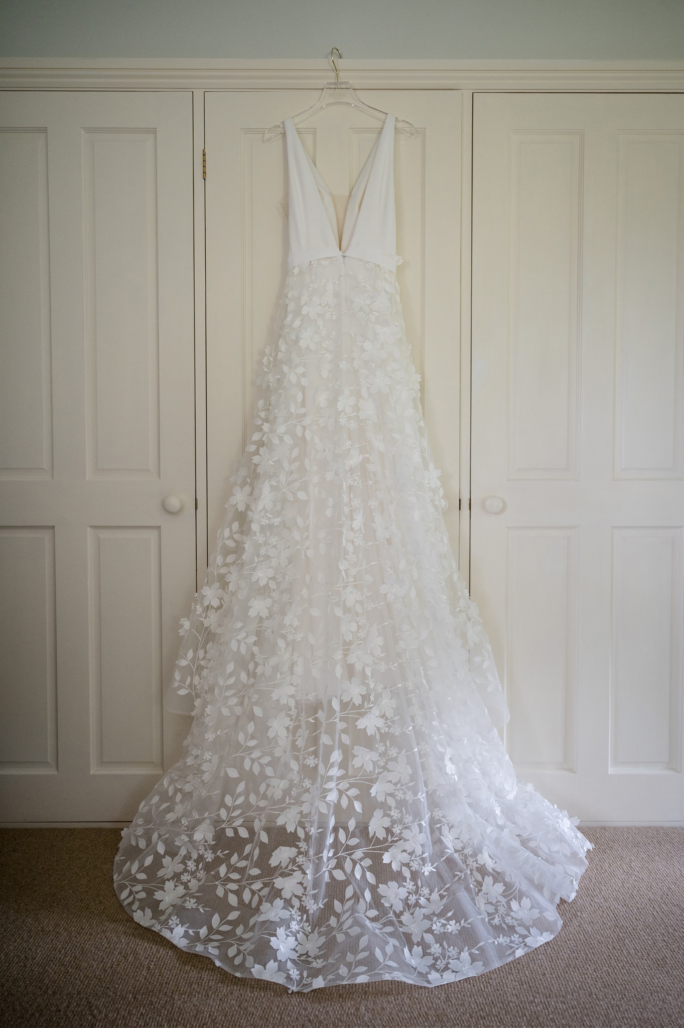 The bride's dress hanging on wardrobe doors