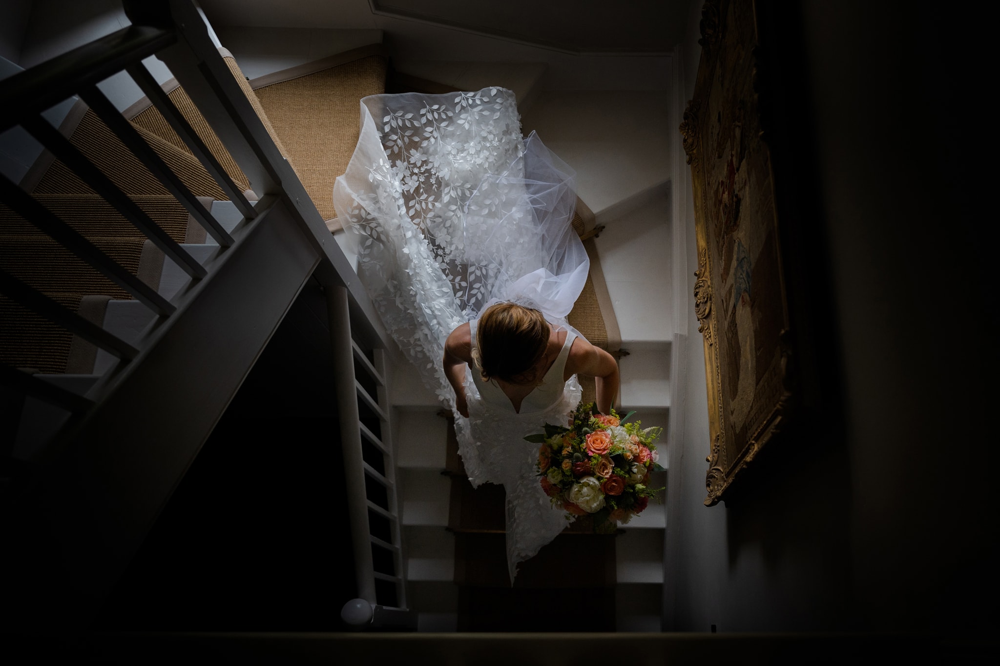 The bride walking down the staircase ready to get married