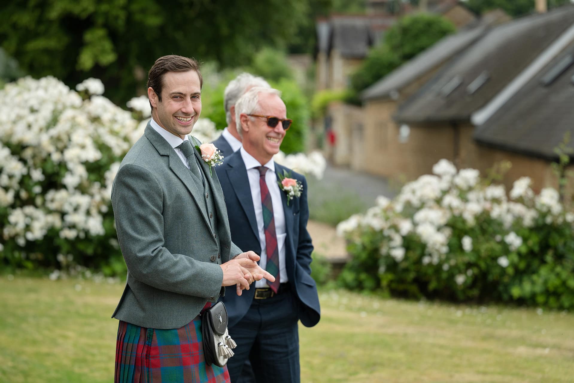 The groom waitiing outside Wing church in Rutland