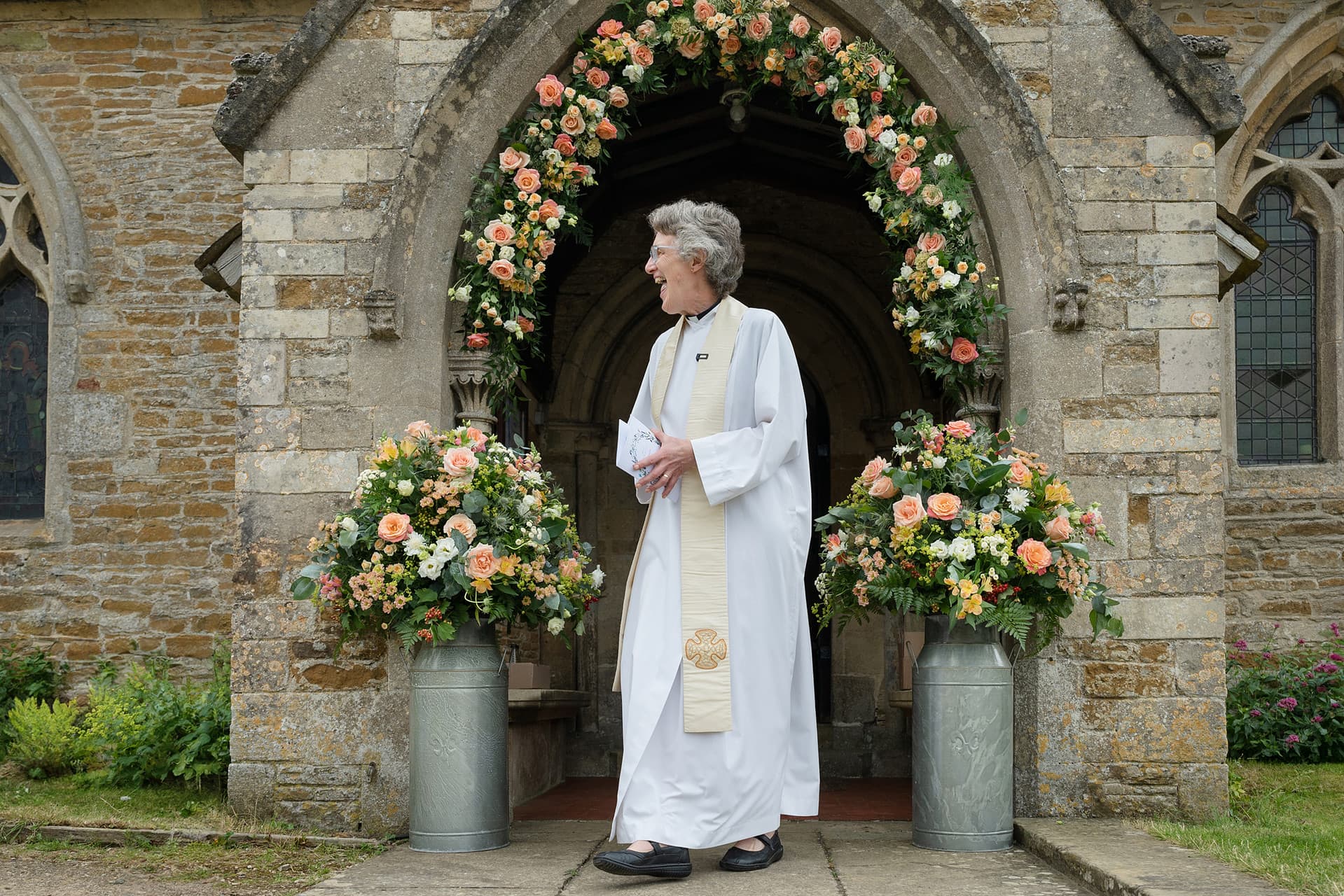 The vicar outside Wing church in Rutland