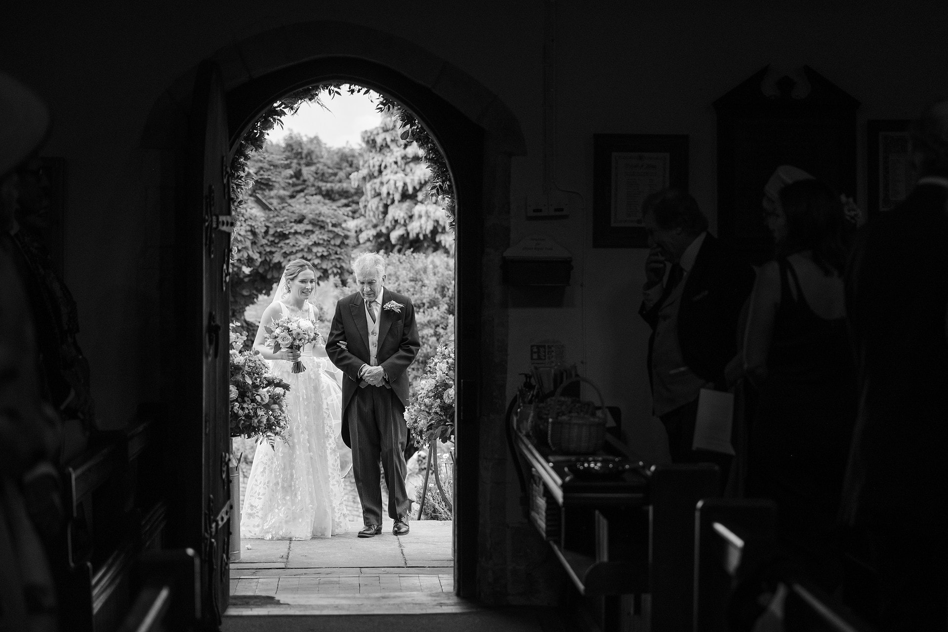 Bride and her dad waiting outside the door to Wing church in Rutland