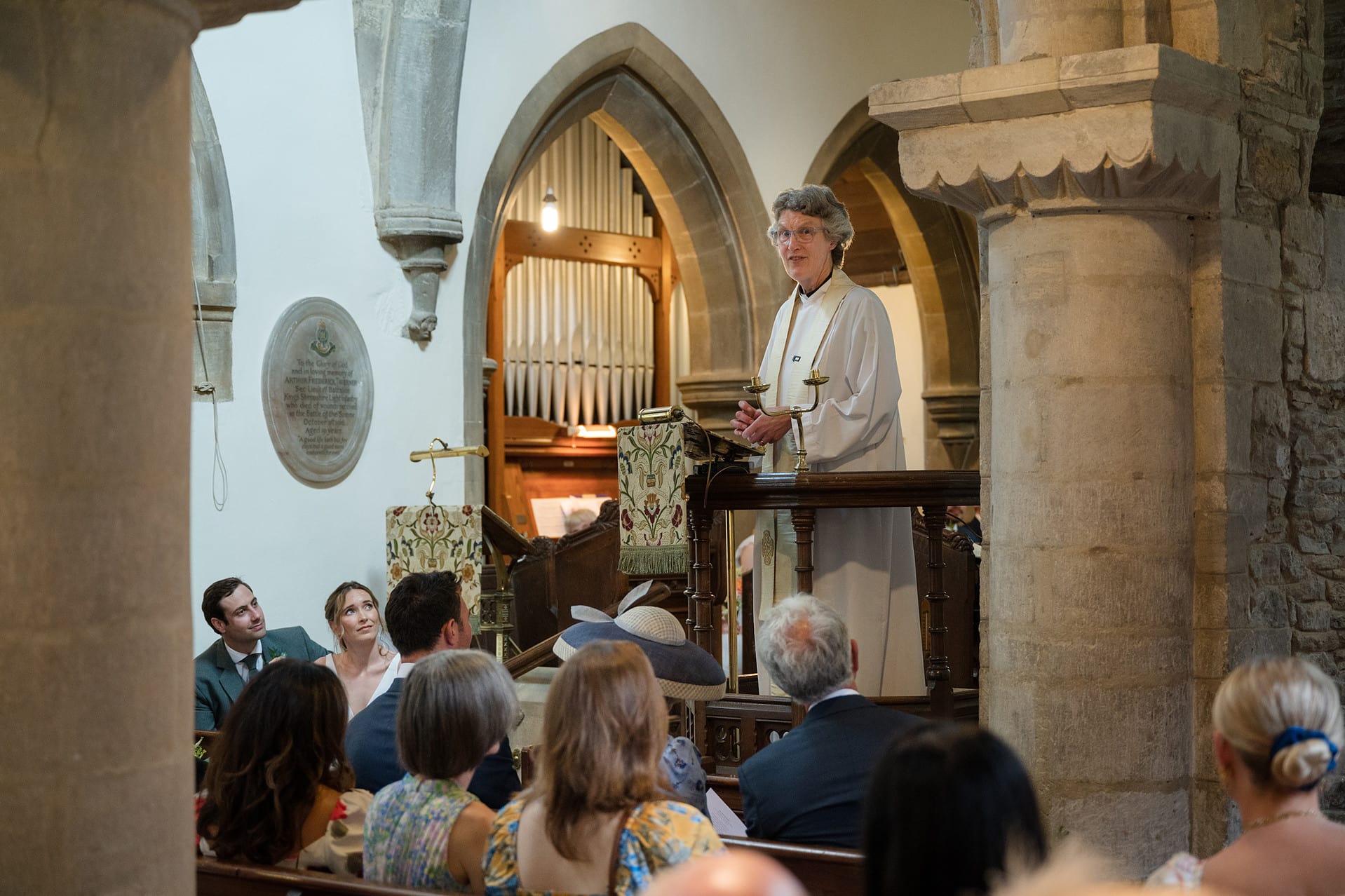 The vicar addressing everyone at a wedding at Wing church in Rutland