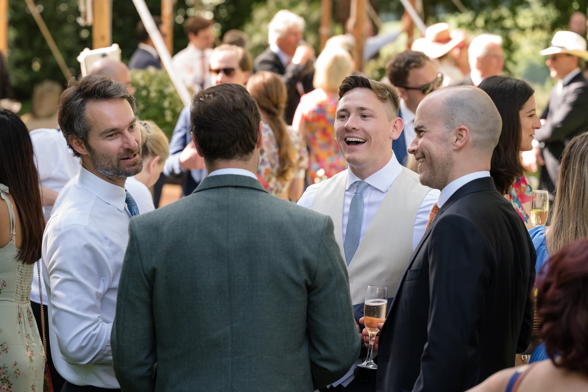 Wedding guests chatting during the drinks reception