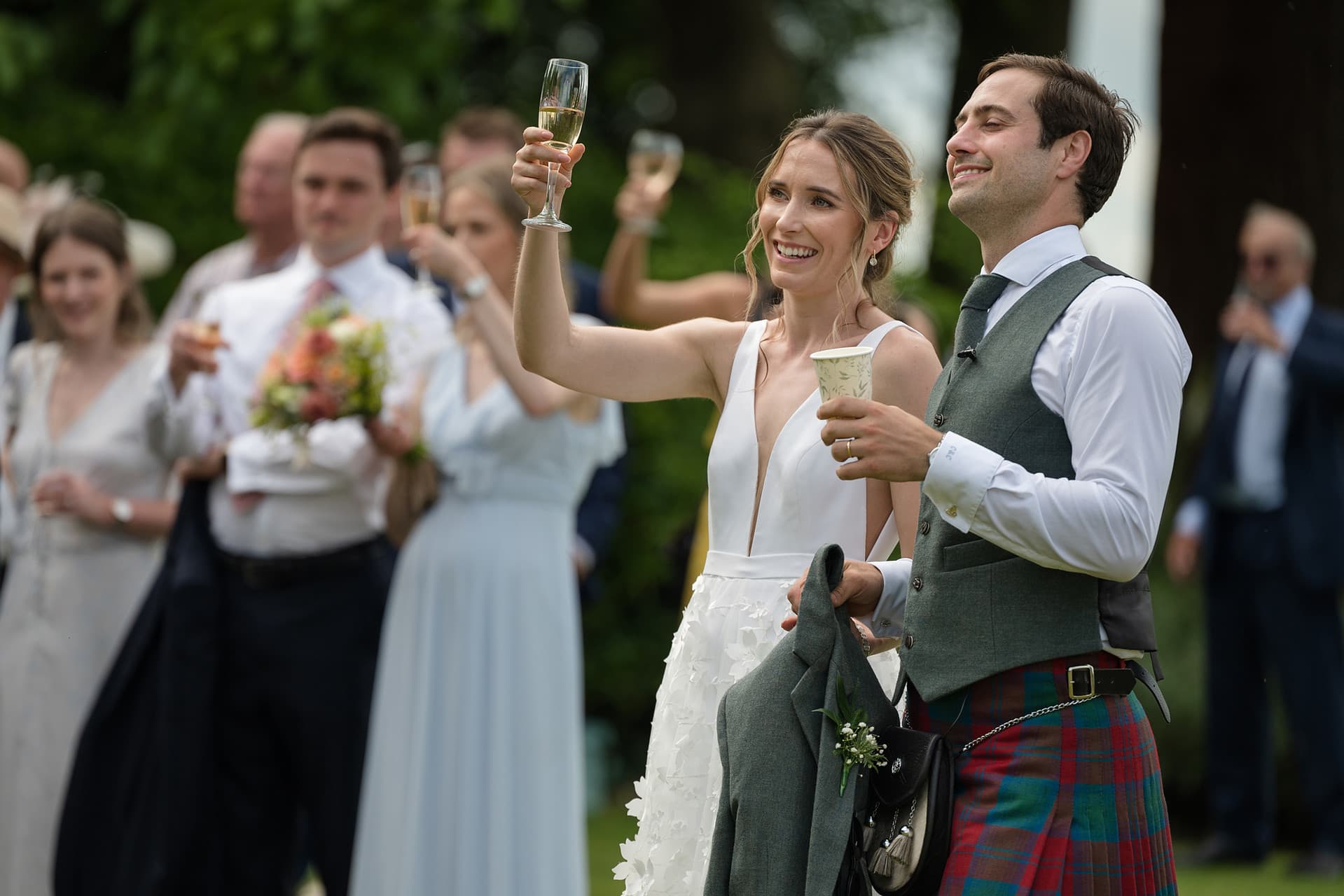 The bride and groom toasting the bride's dad's speech