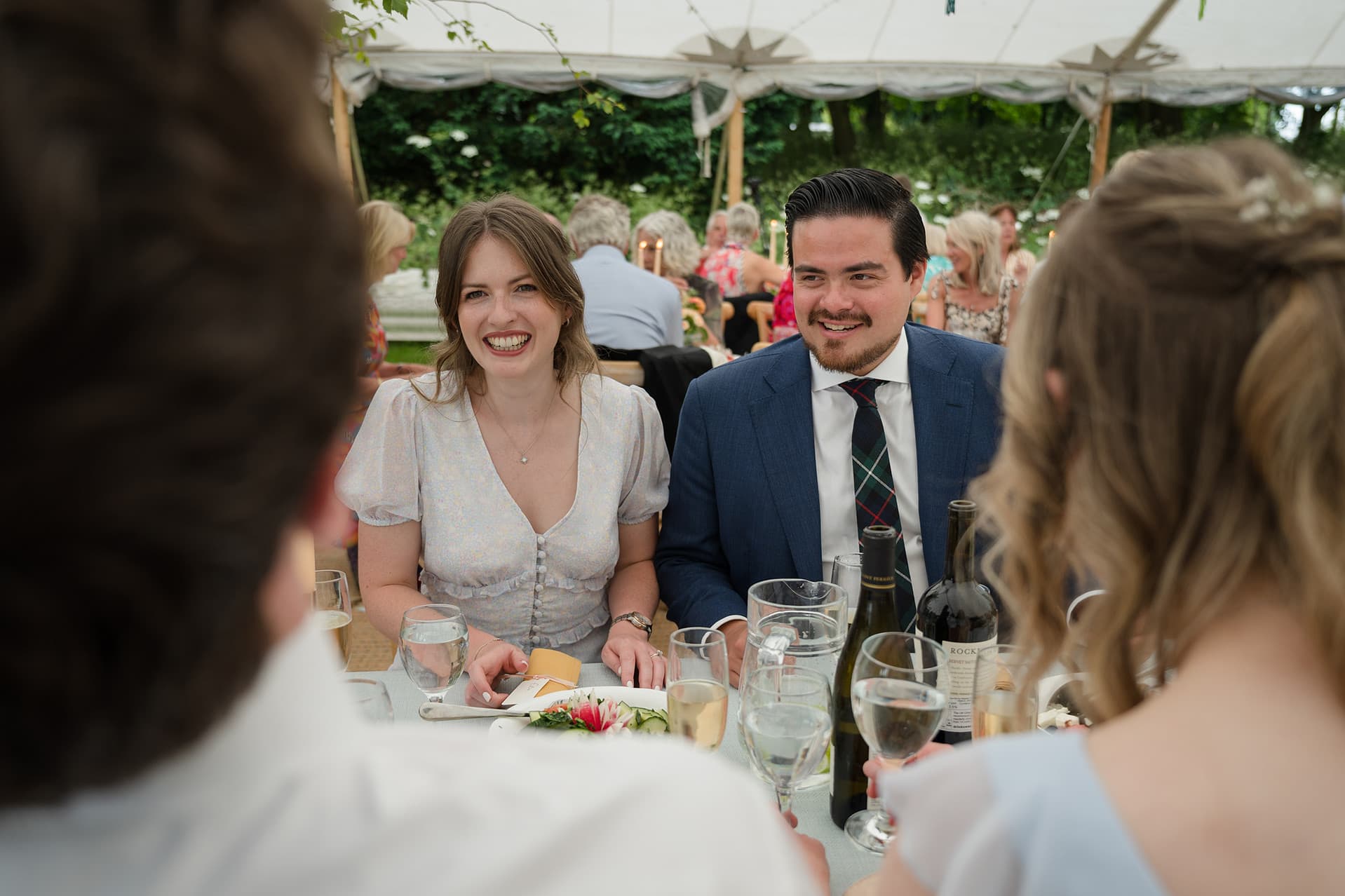 Wedding guests chatting at the table before dinner