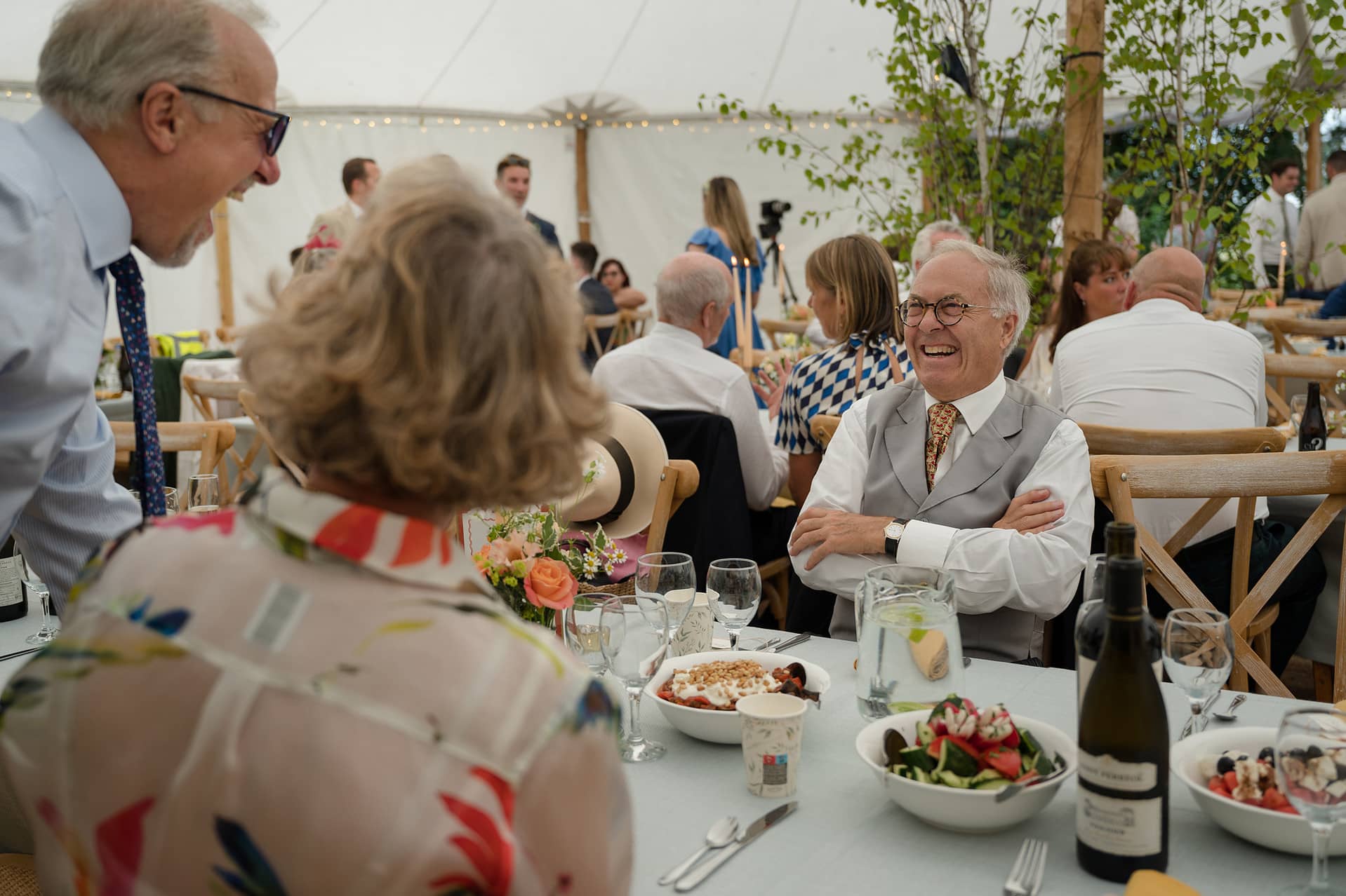 Wedding guests chatting at the table before dinner