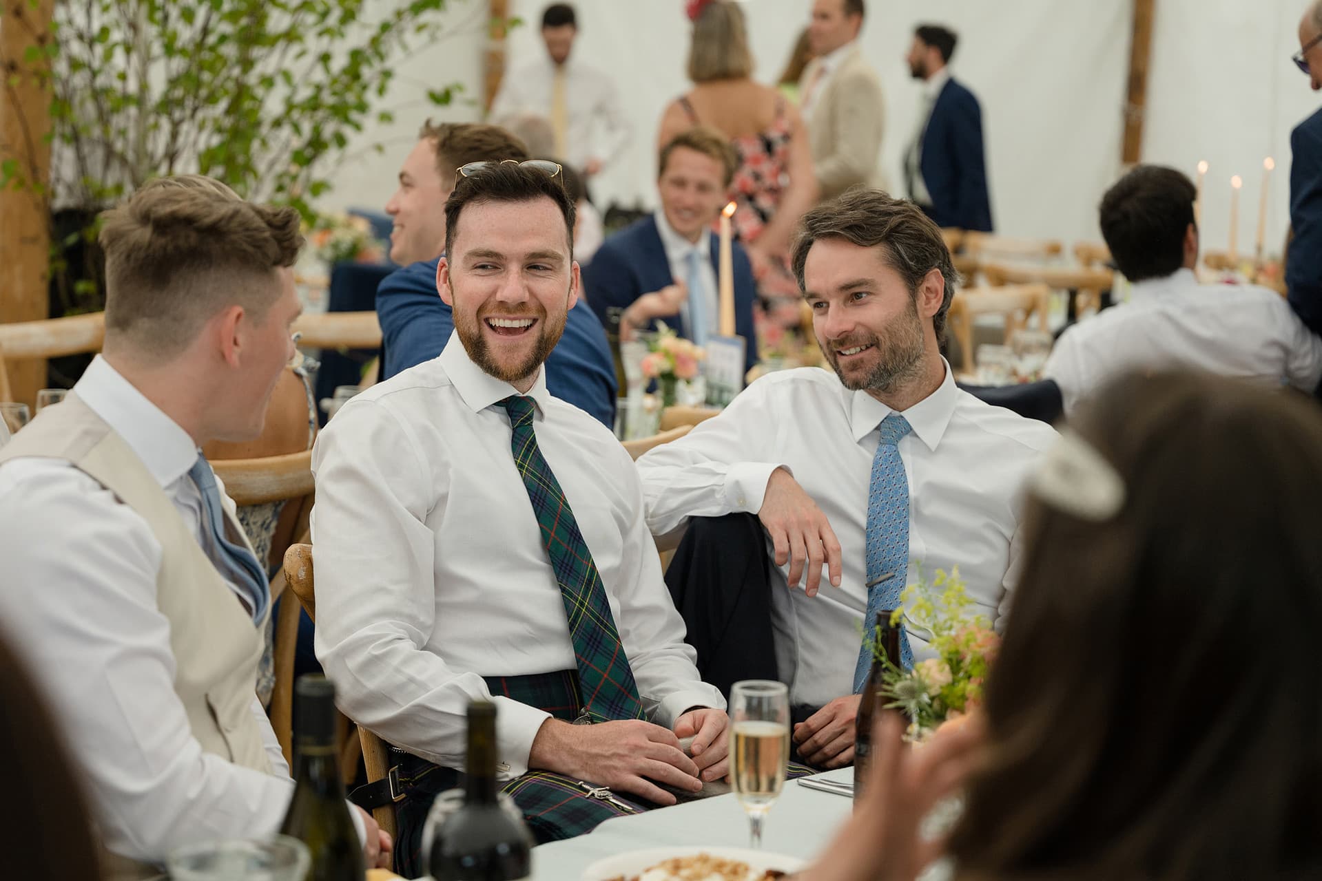 Wedding guests chatting at the table before dinner