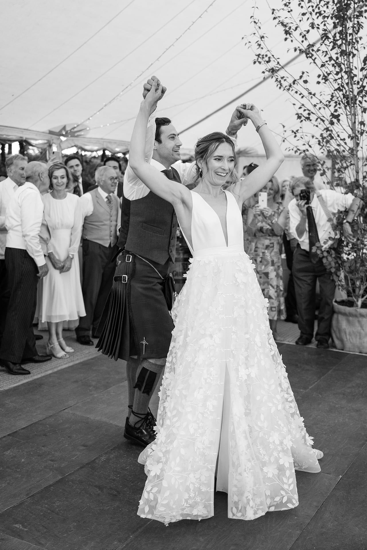 Groom twirling the bride during their first dance