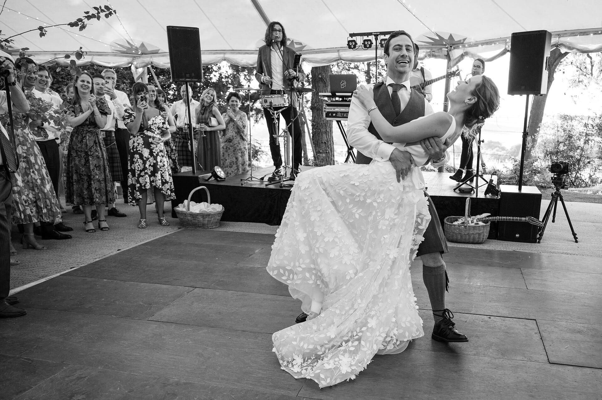 Groom dipping the bride at the end of their first dance