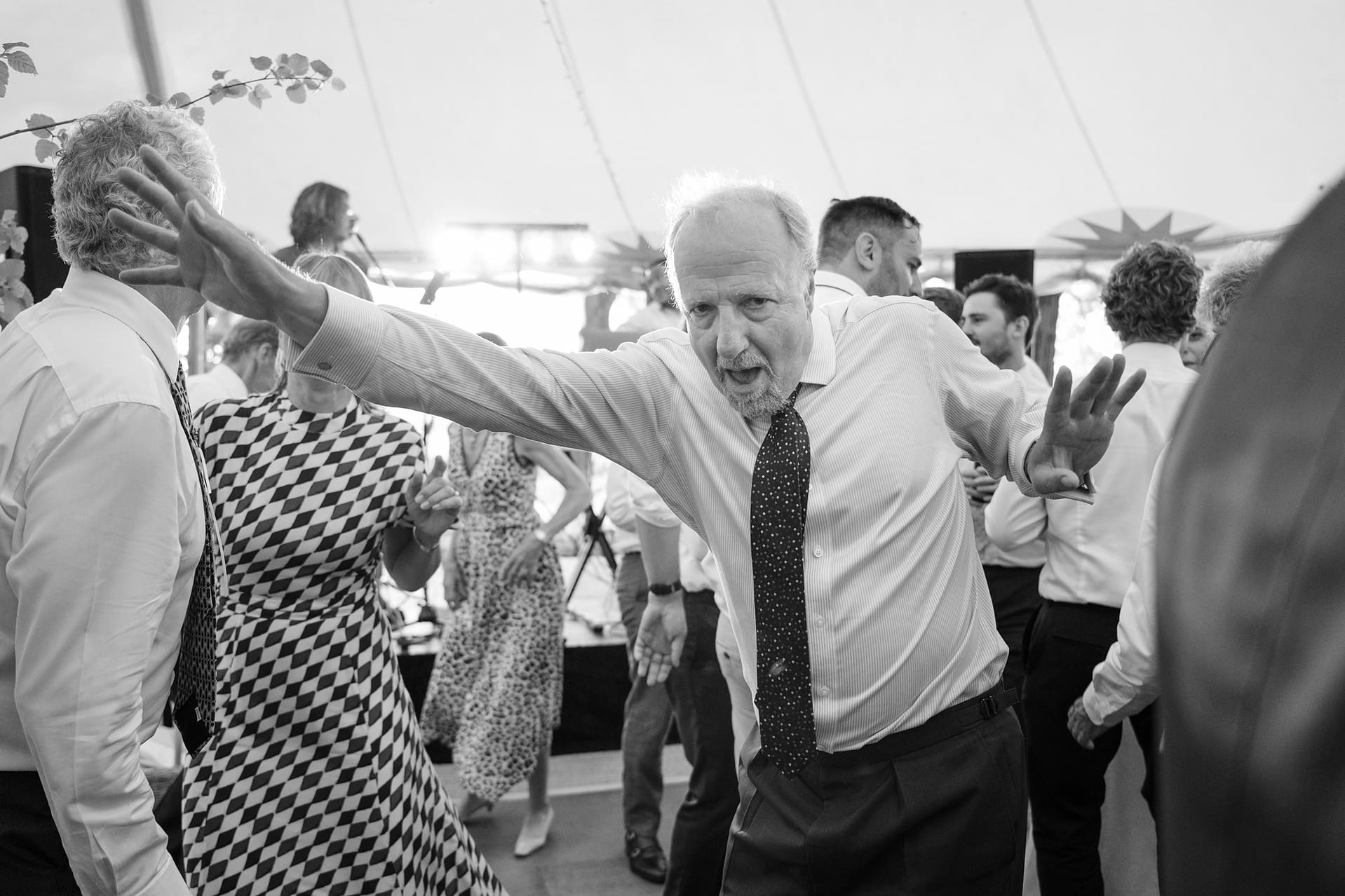 A wedding guest dancing