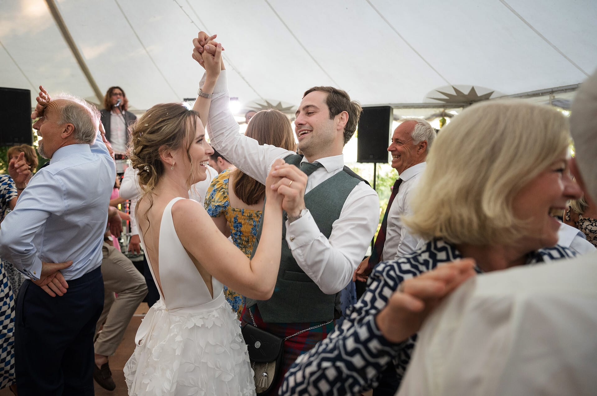 Bride and groom dancing with their wedding guests